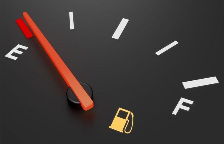 Fuel gauge on car reading E for Empty.